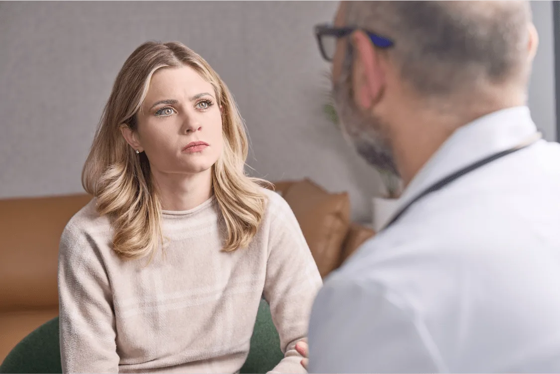 A patient speaking with a doctor